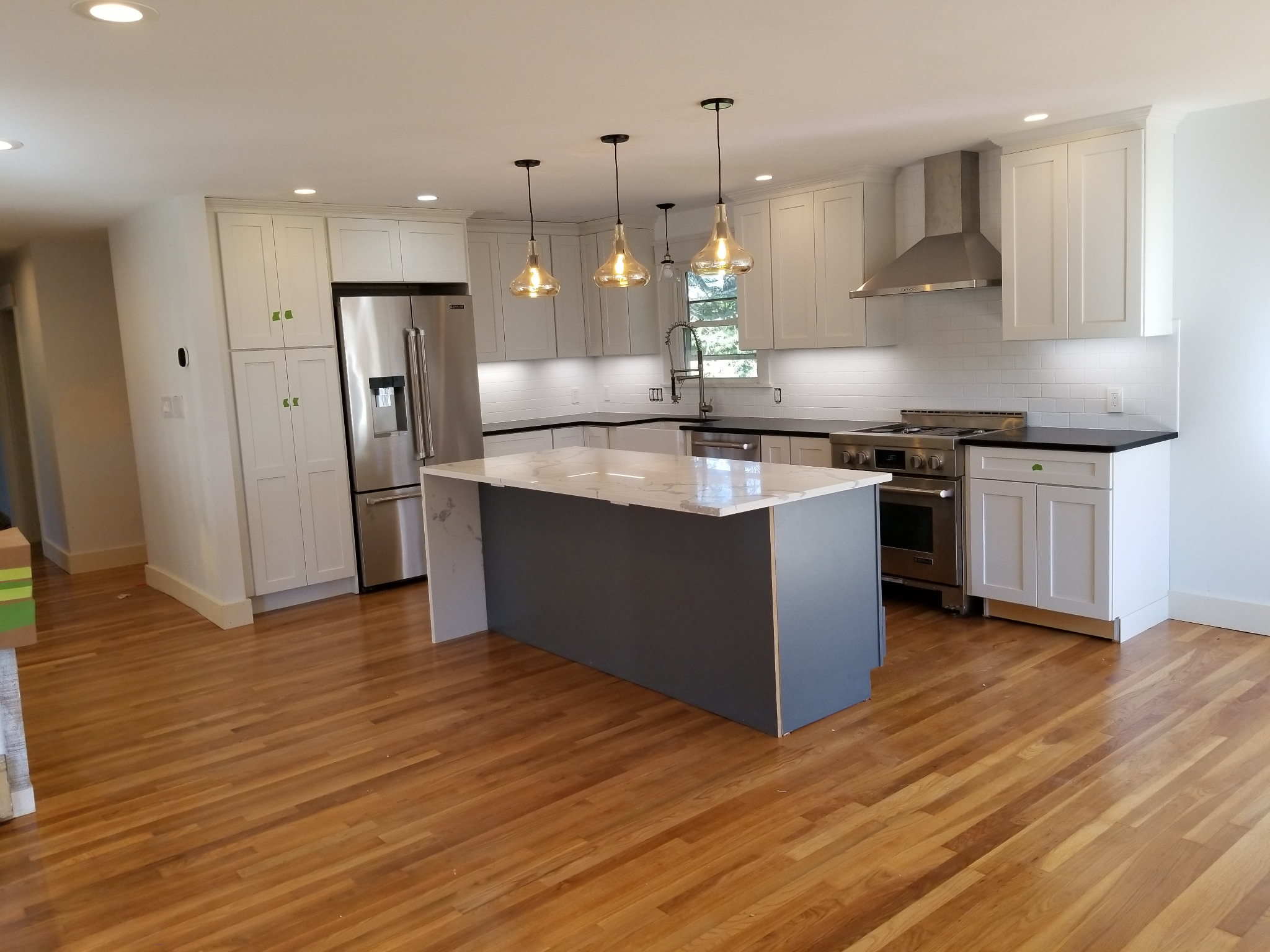 Completed kitchen pendant, recessed, and under-cabinet lighting project