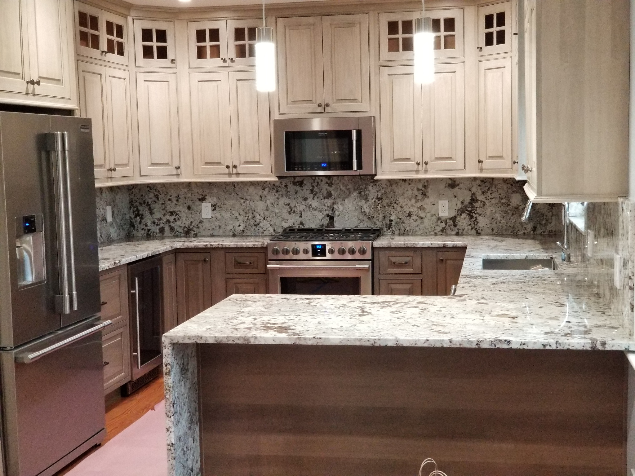 Renovated kitchen with pendant lighting and appliance wiring